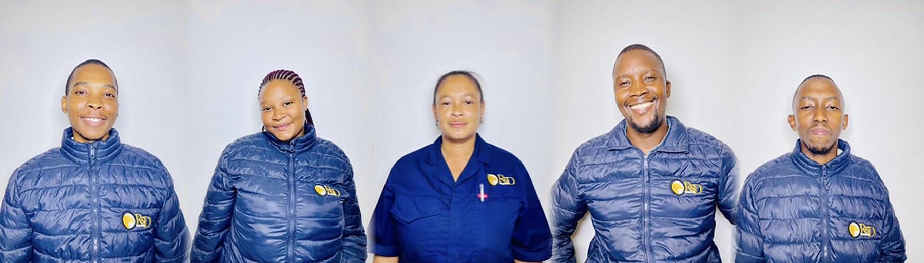 The R&D Technologies team in branded jackets and workwear